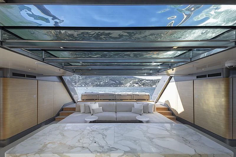 a room with a view of the snowy mountains and a pool aboard ATTILA Yacht for Sale
