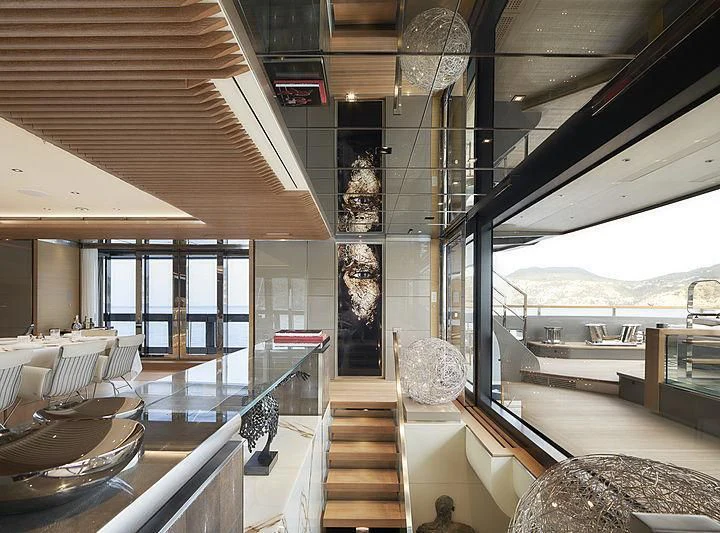 a room with a view of the water and the deck aboard ATTILA Yacht for Sale