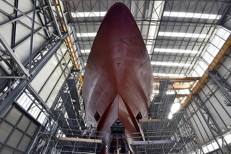 a large red statue in a large building aboard ATTILA Yacht for Sale