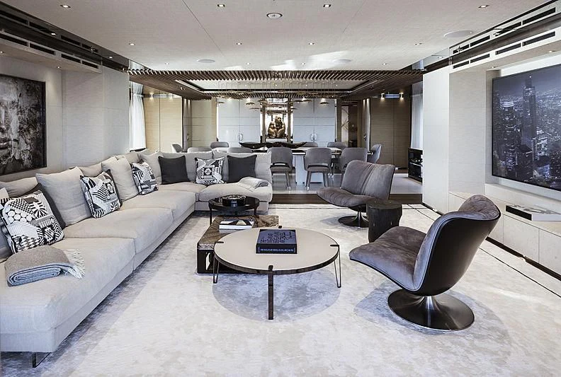 a living room with a large sofa and a coffee table aboard ATTILA Yacht for Sale