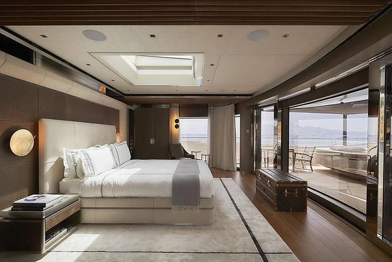 a large bedroom with a large bed aboard ATTILA Yacht for Sale