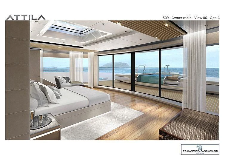 a room with a couch and a large window aboard ATTILA Yacht for Sale