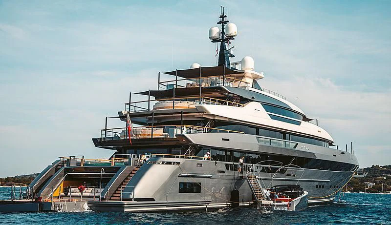 a large cruise ship docked aboard ATTILA Yacht for Sale