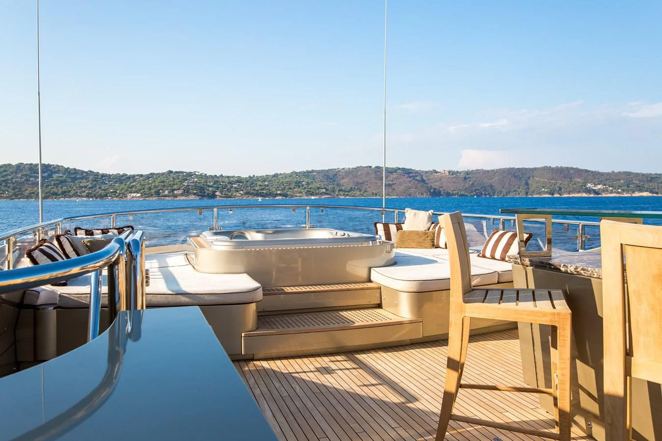 a deck with chairs on it aboard GENESIS Yacht for Sale
