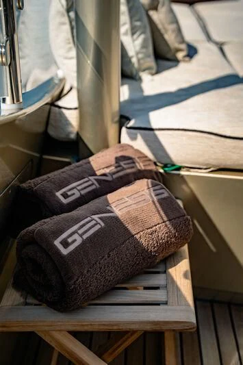 a brown leather boot on a wooden surface aboard GENESIS Yacht for Sale