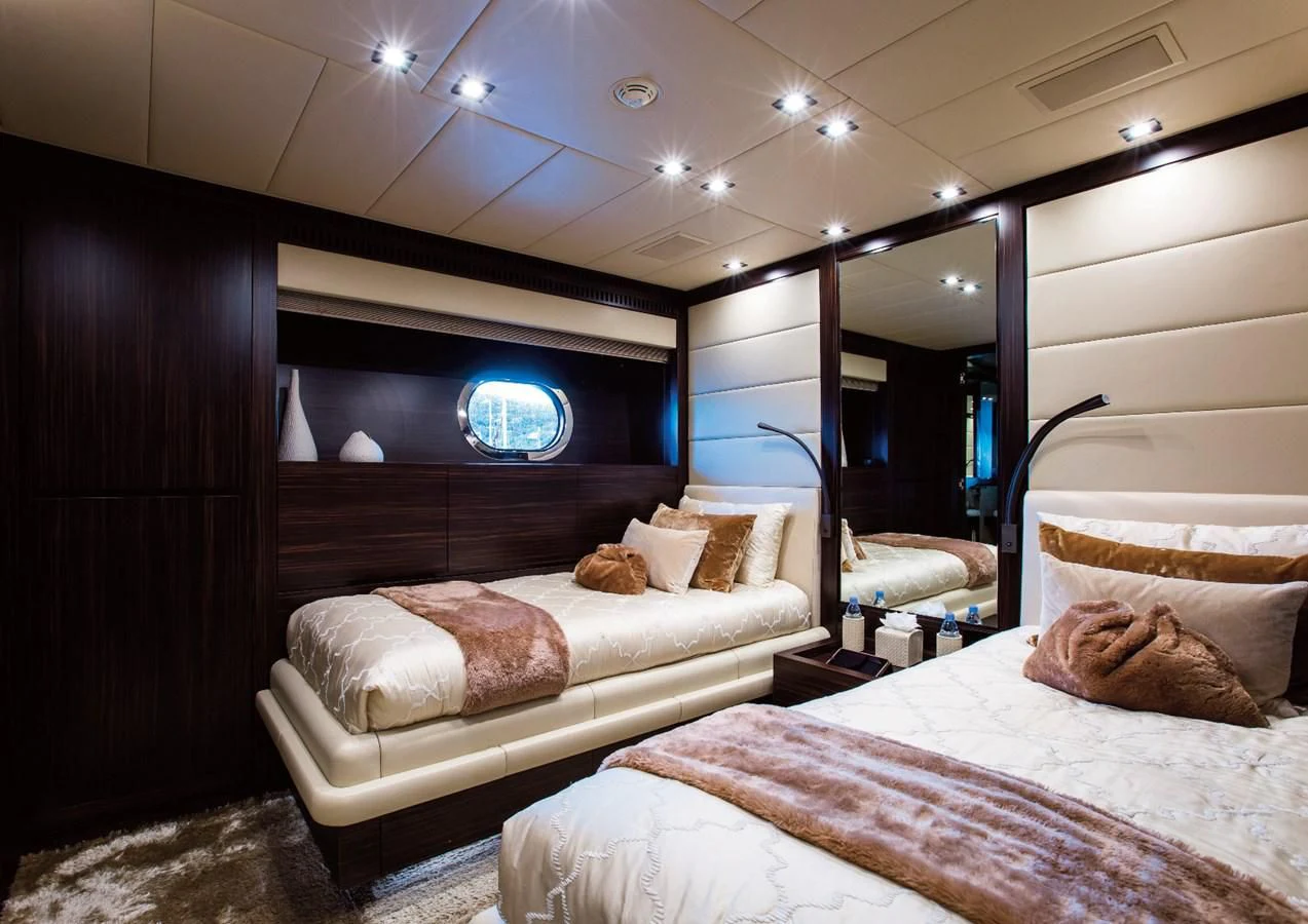 a room with two beds aboard GENESIS Yacht for Sale