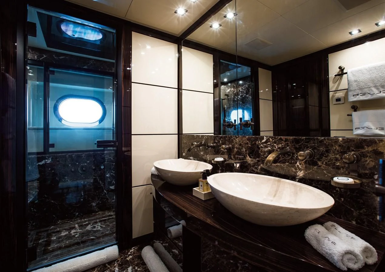 a bathroom with a large mirror aboard GENESIS Yacht for Sale