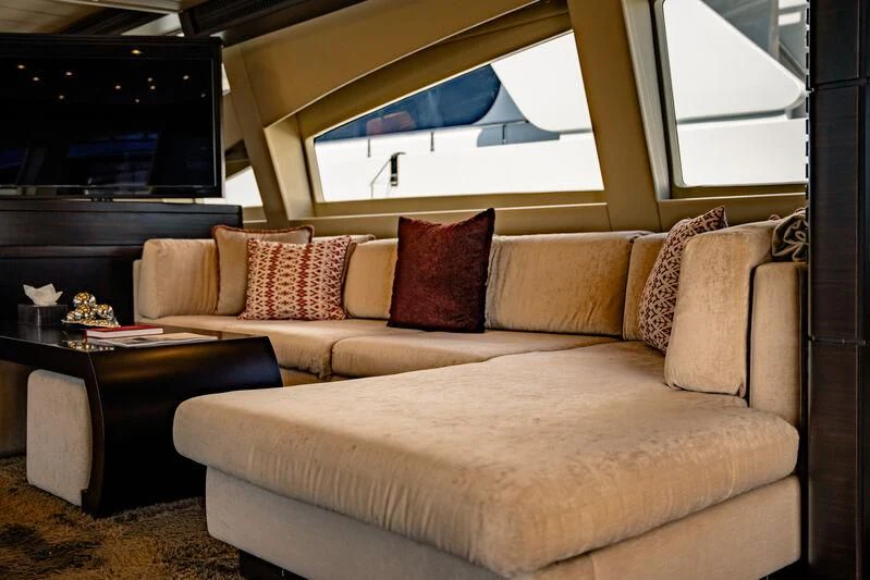 a couch with pillows aboard GENESIS Yacht for Sale