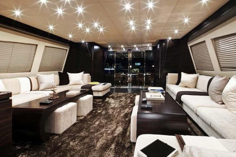 a room with a couch and a table aboard GENESIS Yacht for Sale