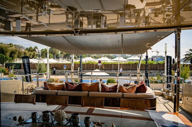 a large room with a large group of birds on a balcony aboard GENESIS Yacht for Sale