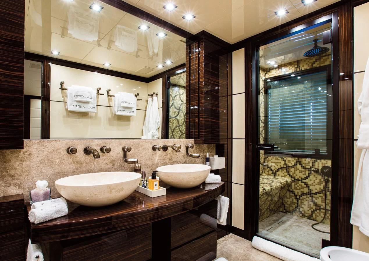 a bathroom with a large mirror aboard GENESIS Yacht for Sale