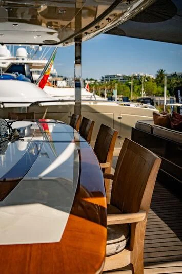 a deck with chairs and a boat aboard GENESIS Yacht for Sale