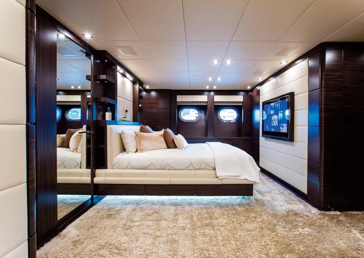 a bed in a room aboard GENESIS Yacht for Sale