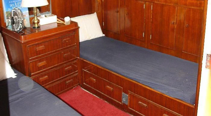 a dresser with a lamp on top aboard WHITE EAGLE Yacht for Sale