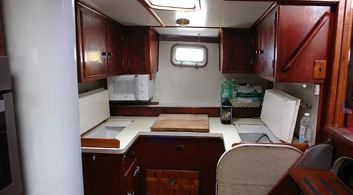 a kitchen with a microwave oven and cabinets aboard WHITE EAGLE Yacht for Sale