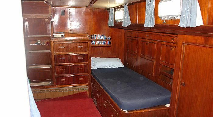 a bed in a room aboard WHITE EAGLE Yacht for Sale