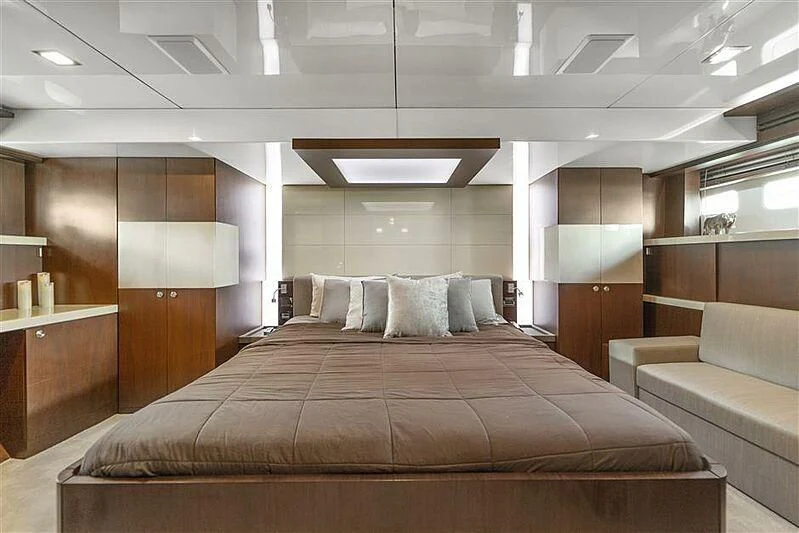 a large bed in a room aboard ADAMO Yacht for Sale