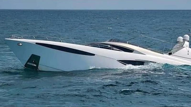 a white yacht in the ocean aboard ADAMO Yacht for Sale