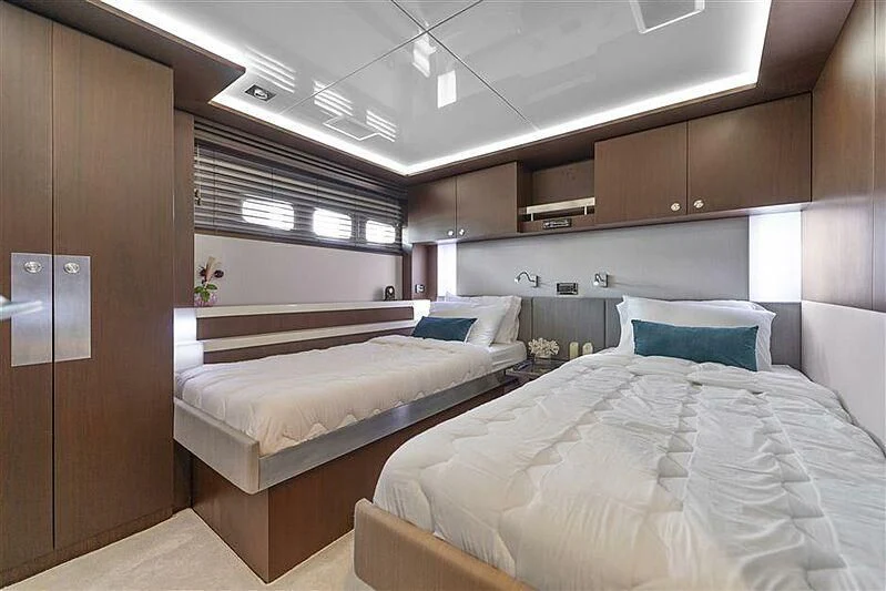 a room with two beds aboard ADAMO Yacht for Sale