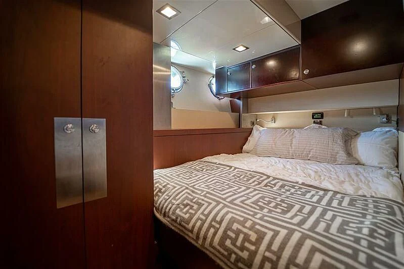 a bed with a white sheet aboard ADAMO Yacht for Sale