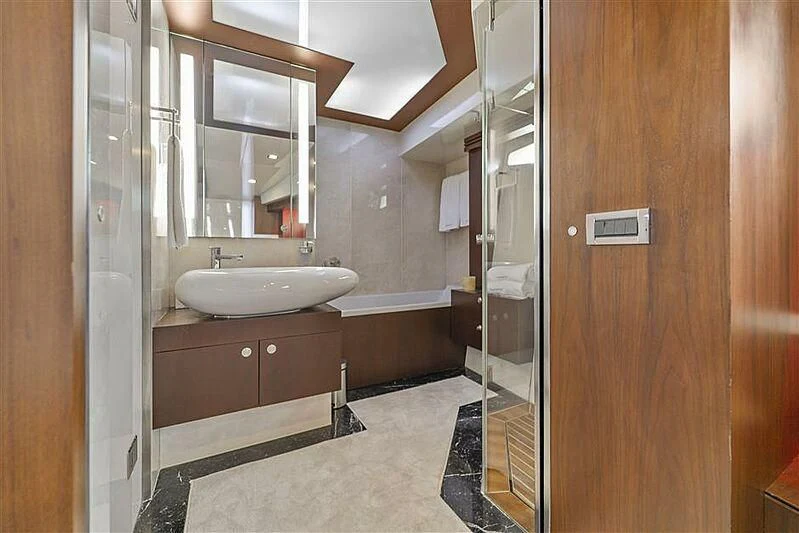 a bathroom with a sink and a mirror aboard ADAMO Yacht for Sale