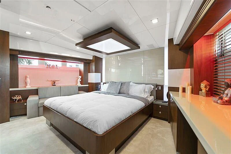 a bedroom with a large bed aboard ADAMO Yacht for Sale