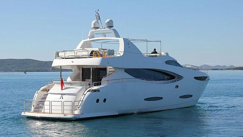 a white yacht in the water aboard ADAMO Yacht for Sale