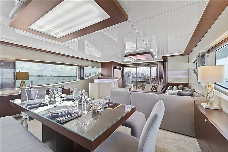 a large room with a table and chairs aboard ADAMO Yacht for Sale