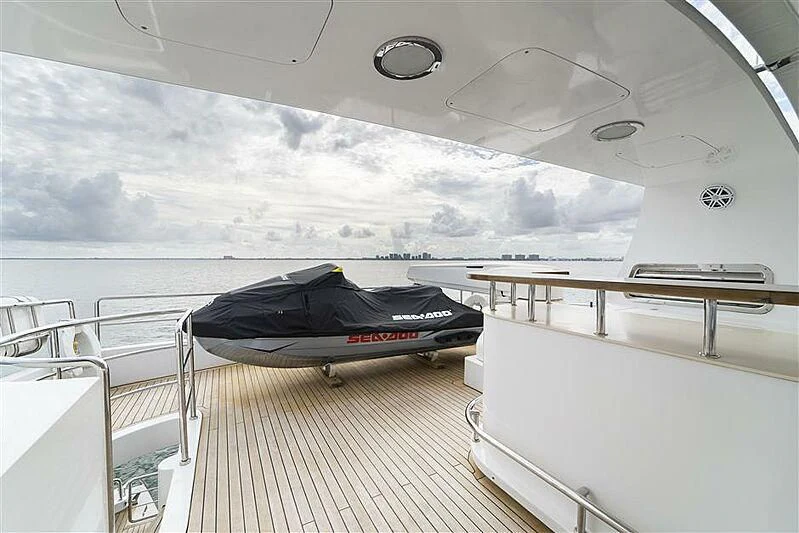 a large white boat with a black tarp on the deck aboard ADAMO Yacht for Sale