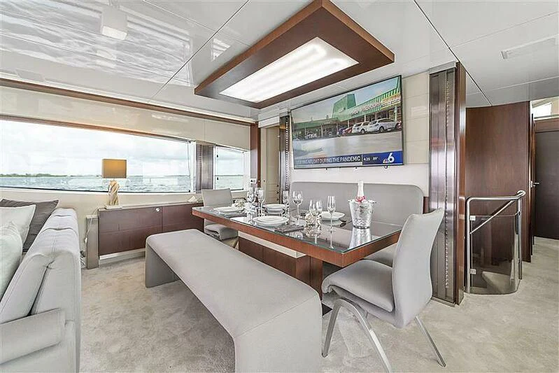 a room with a table and chairs aboard ADAMO Yacht for Sale