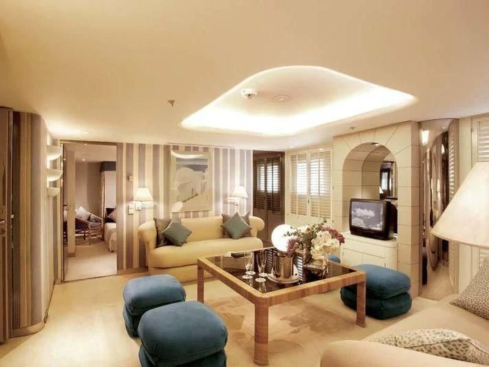 a living room with a couch and a television aboard ALEXANDER Yacht for Sale