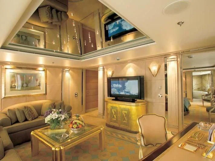 a living room with a tv and a table aboard ALEXANDER Yacht for Sale