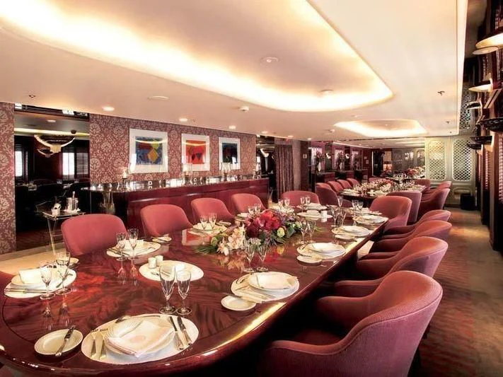 a large dining room with tables and chairs aboard ALEXANDER Yacht for Sale