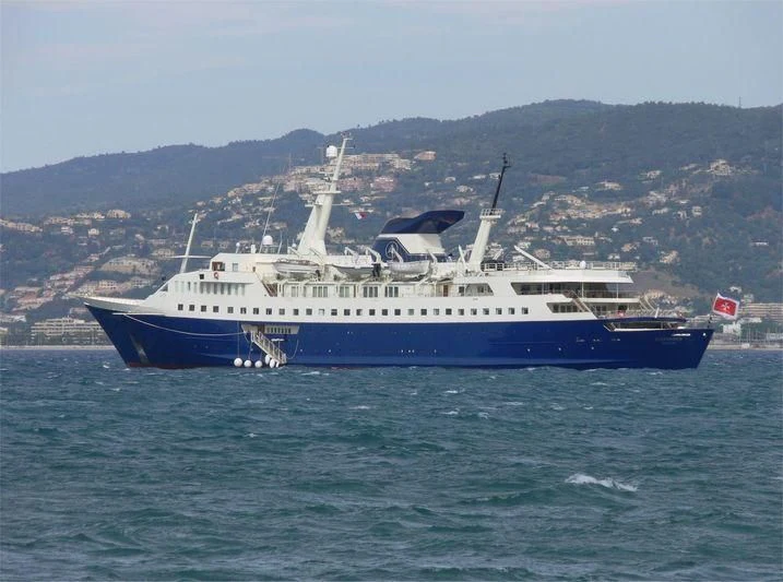 a large blue and white boat in the water aboard ALEXANDER Yacht for Sale