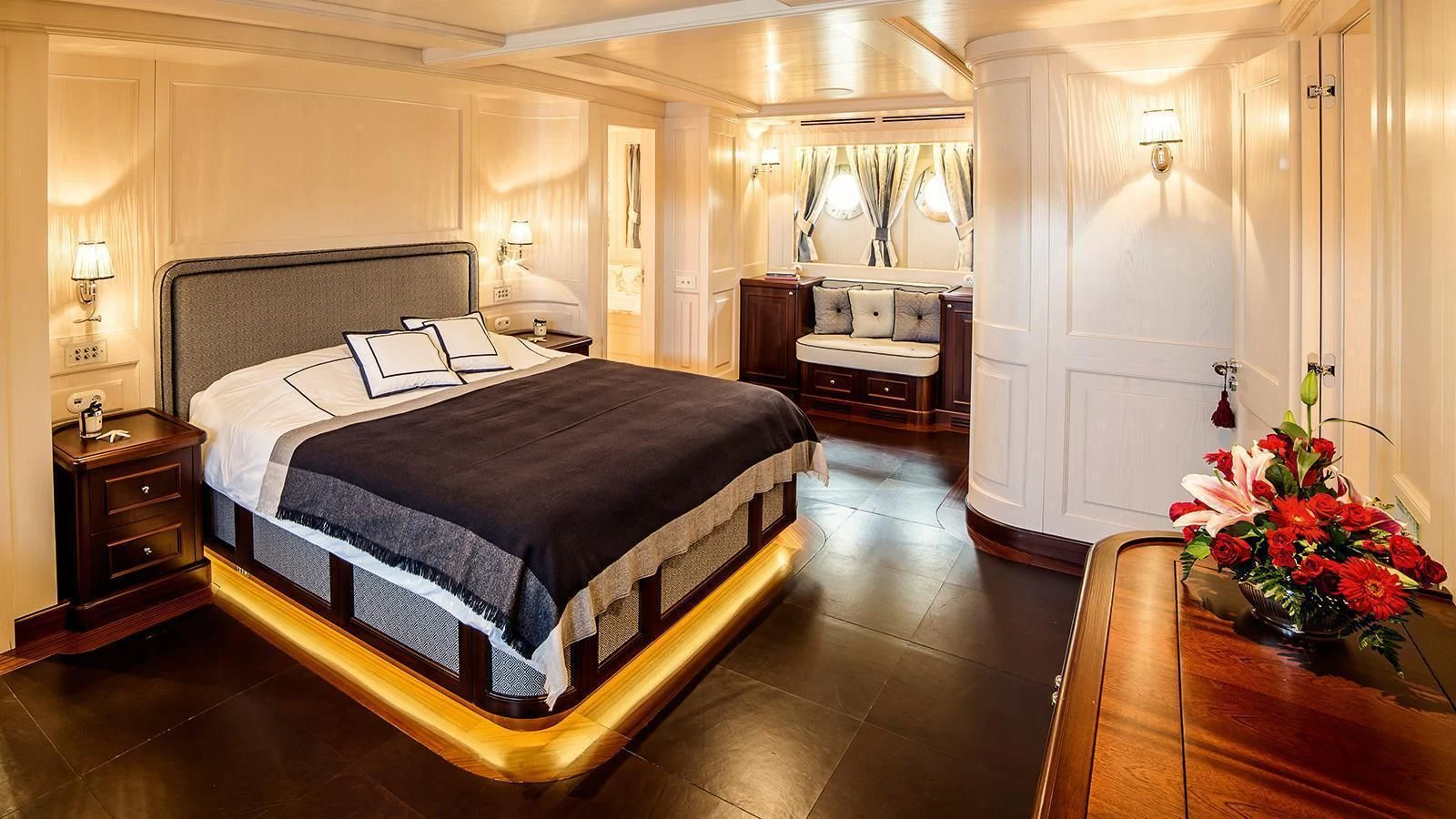 a large bedroom with a large bed aboard TARANSAY Yacht for Sale
