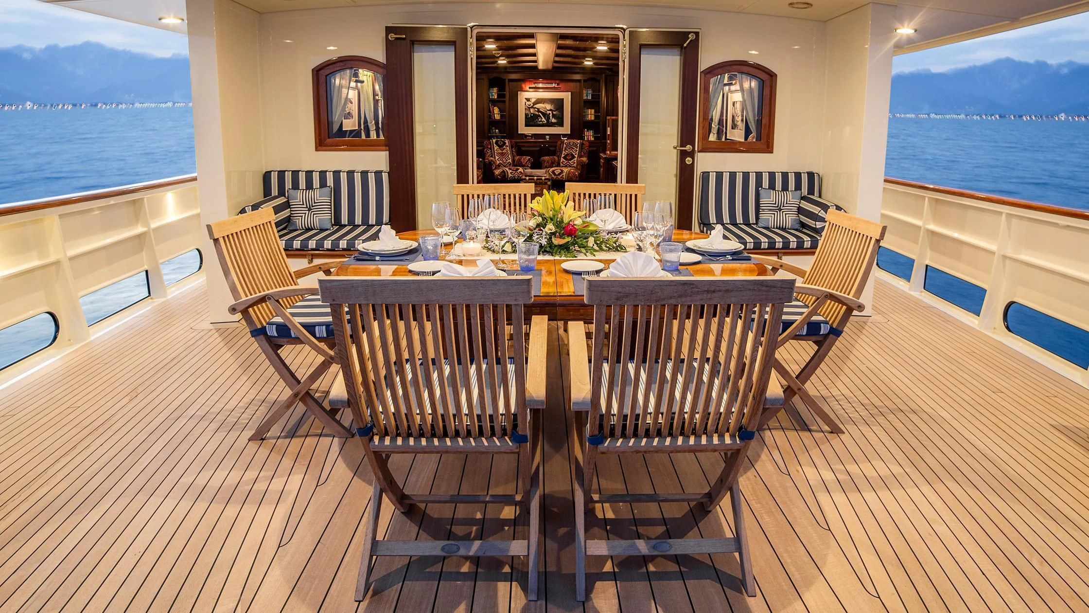 a dining room with a table and chairs aboard TARANSAY Yacht for Sale