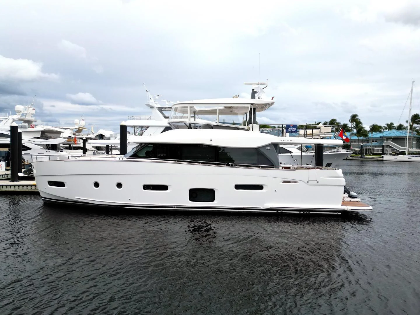 a white boat in a body of water aboard RAINBOW GODDESS Yacht for Sale