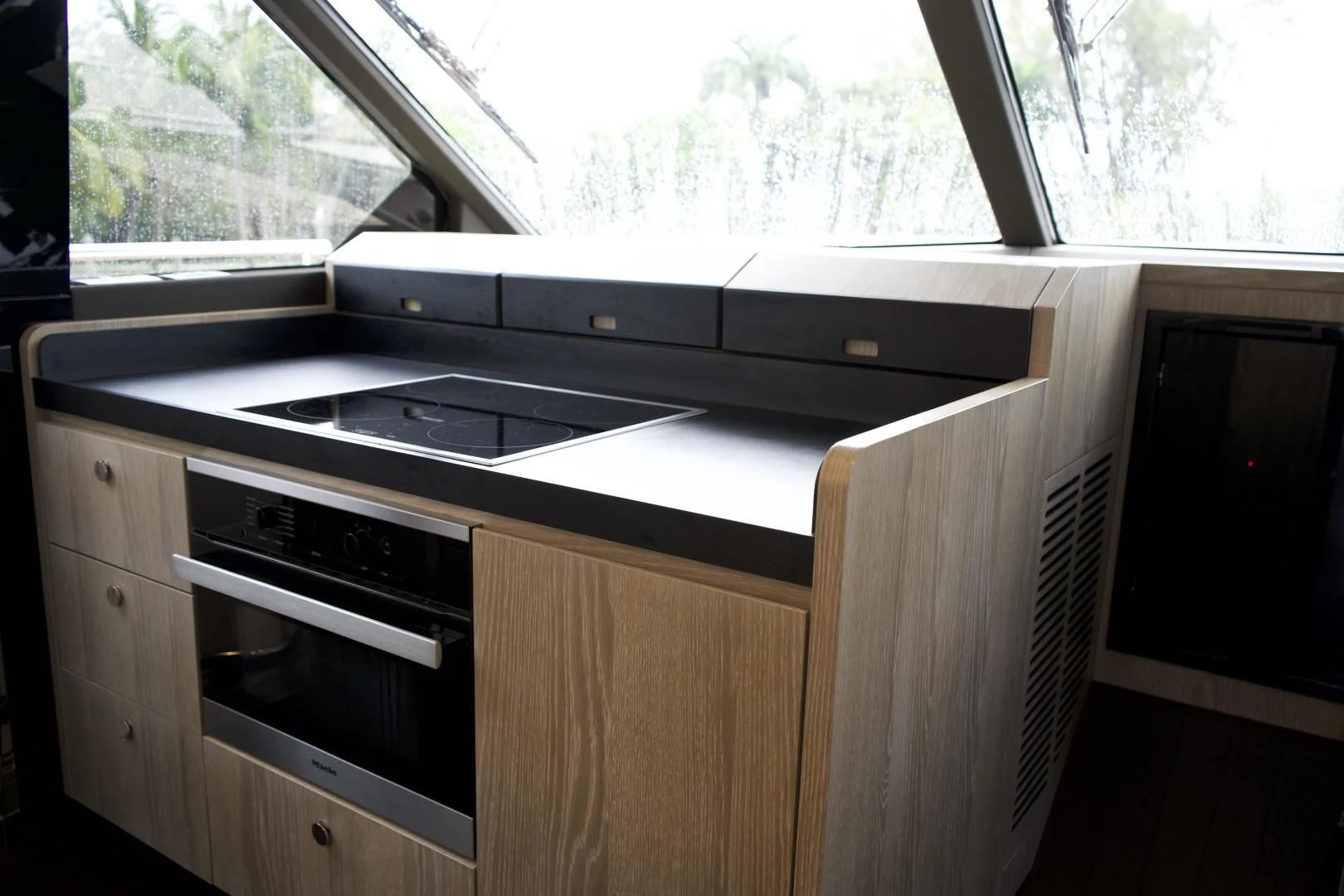 a kitchen with a stove and cabinets aboard RAINBOW GODDESS Yacht for Sale