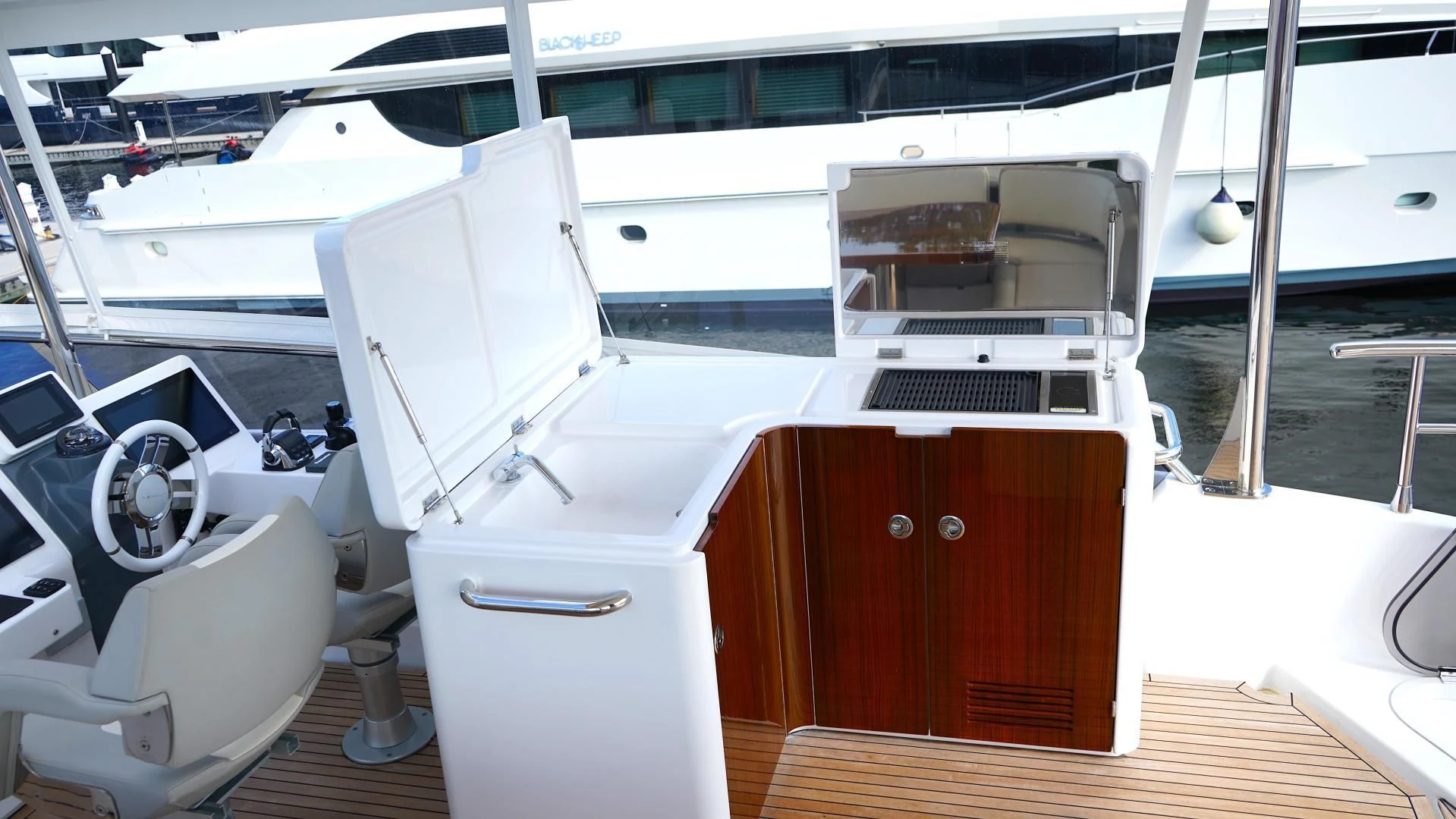 a white boat with a fan aboard RAINBOW GODDESS Yacht for Sale