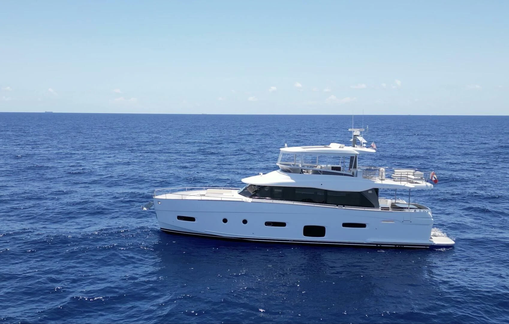 a white yacht in the water aboard RAINBOW GODDESS Yacht for Sale
