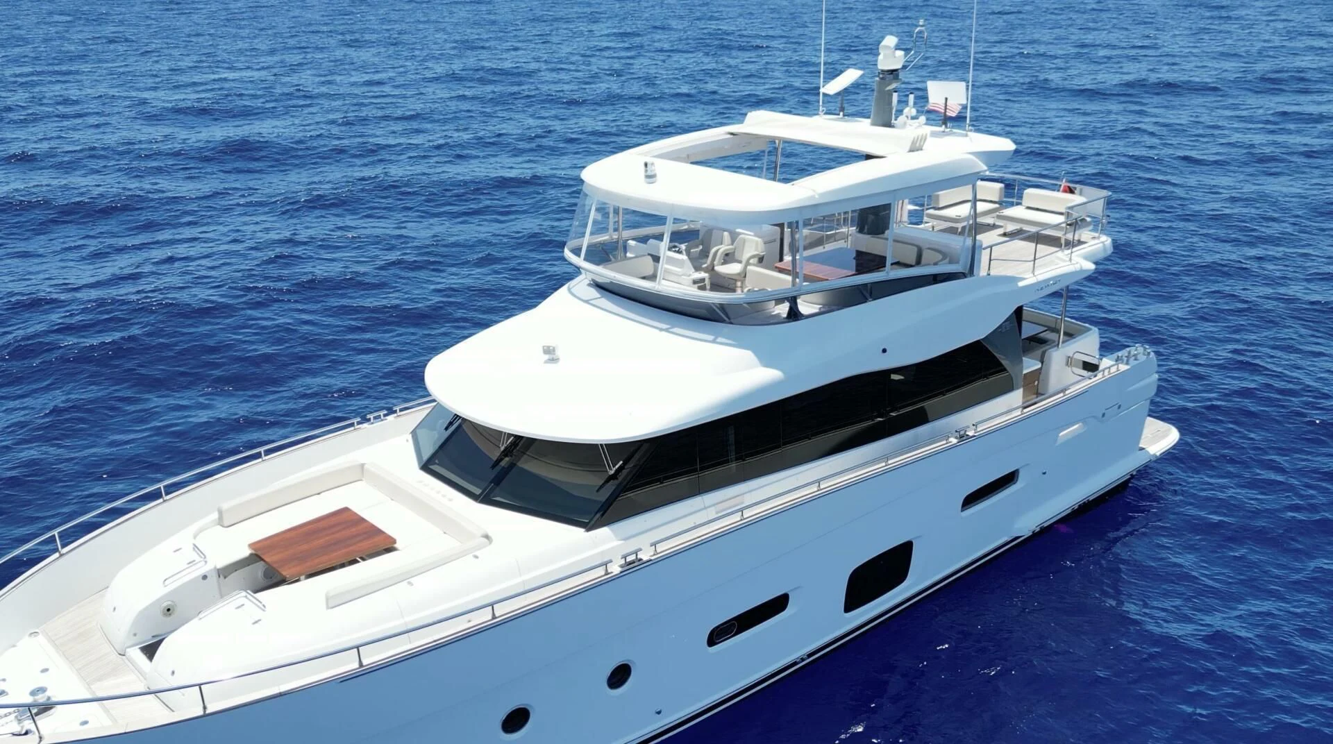 a white boat on the water aboard RAINBOW GODDESS Yacht for Sale