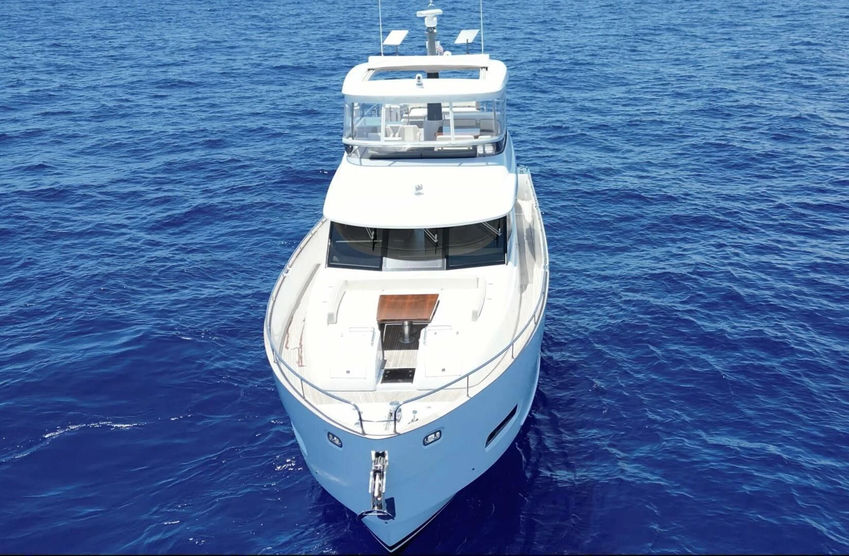 a white boat in the water aboard RAINBOW GODDESS Yacht for Sale