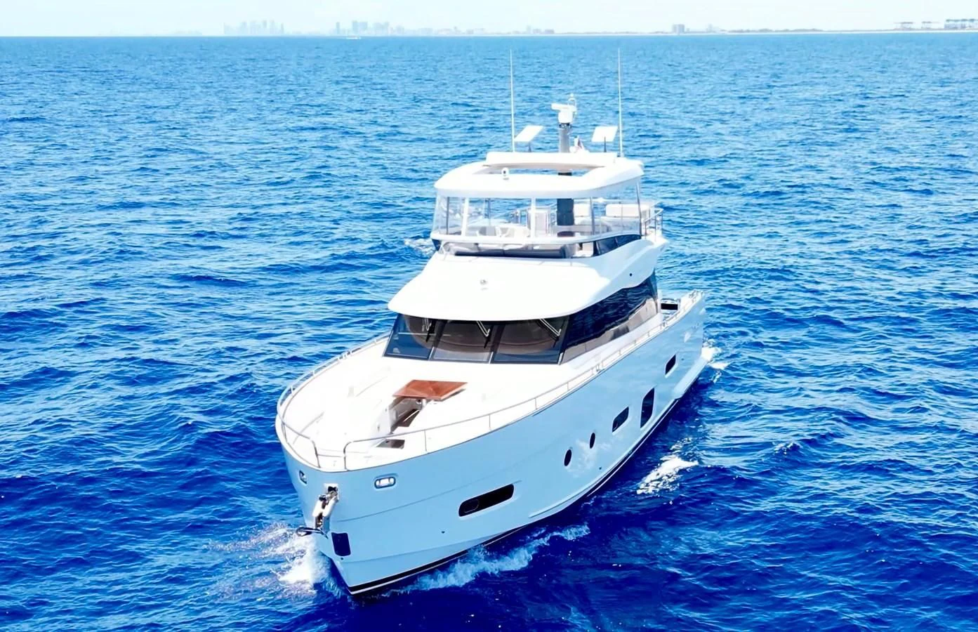 a white boat in the water aboard RAINBOW GODDESS Yacht for Sale