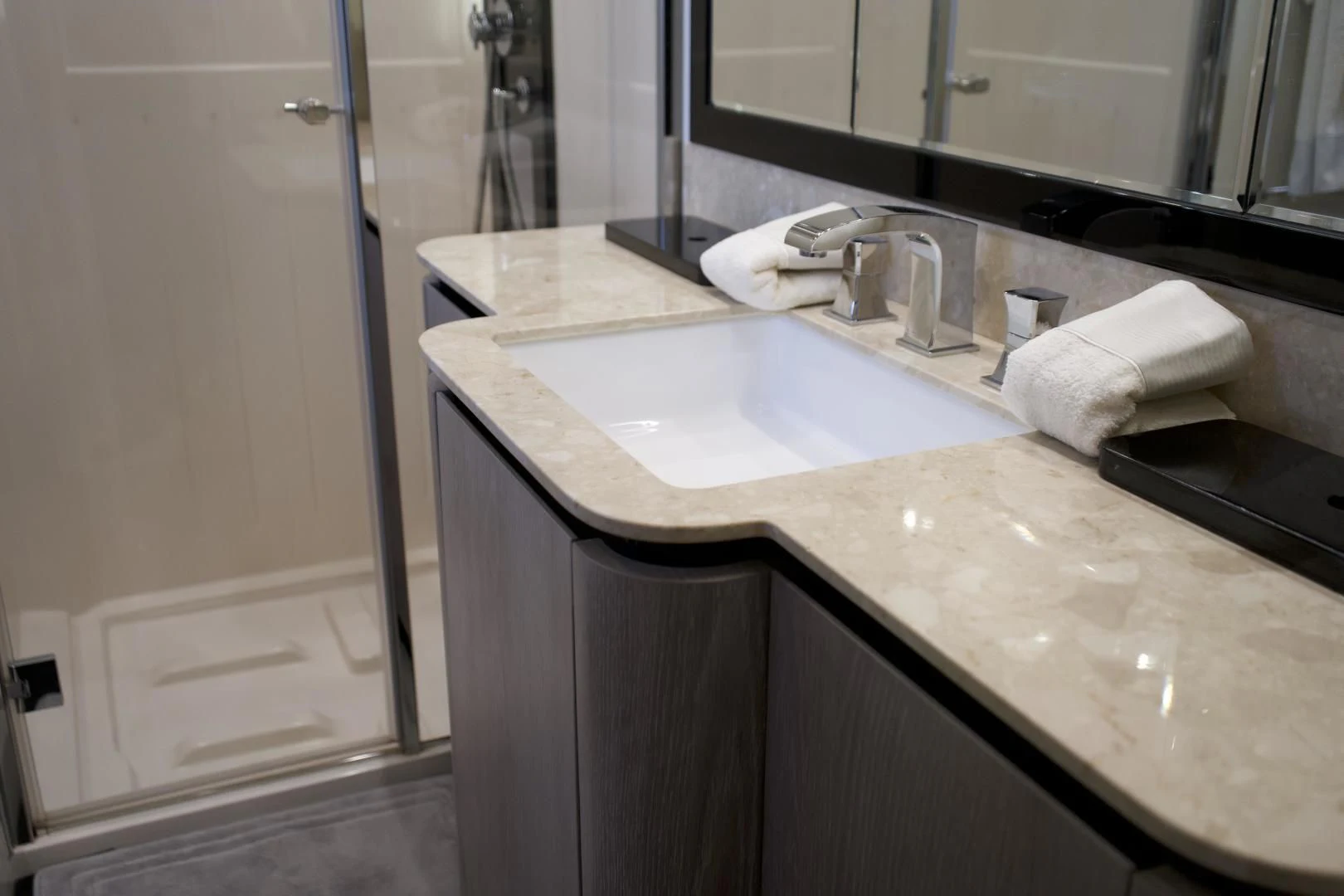 a bathroom with a sink and a mirror aboard RAINBOW GODDESS Yacht for Sale
