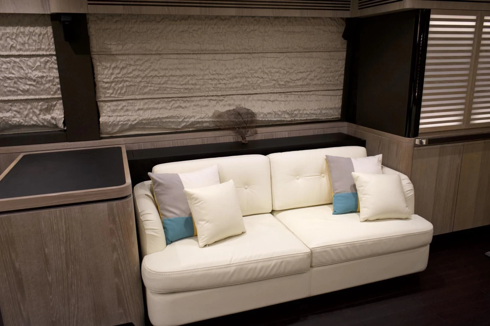 a white couch with pillows aboard RAINBOW GODDESS Yacht for Sale