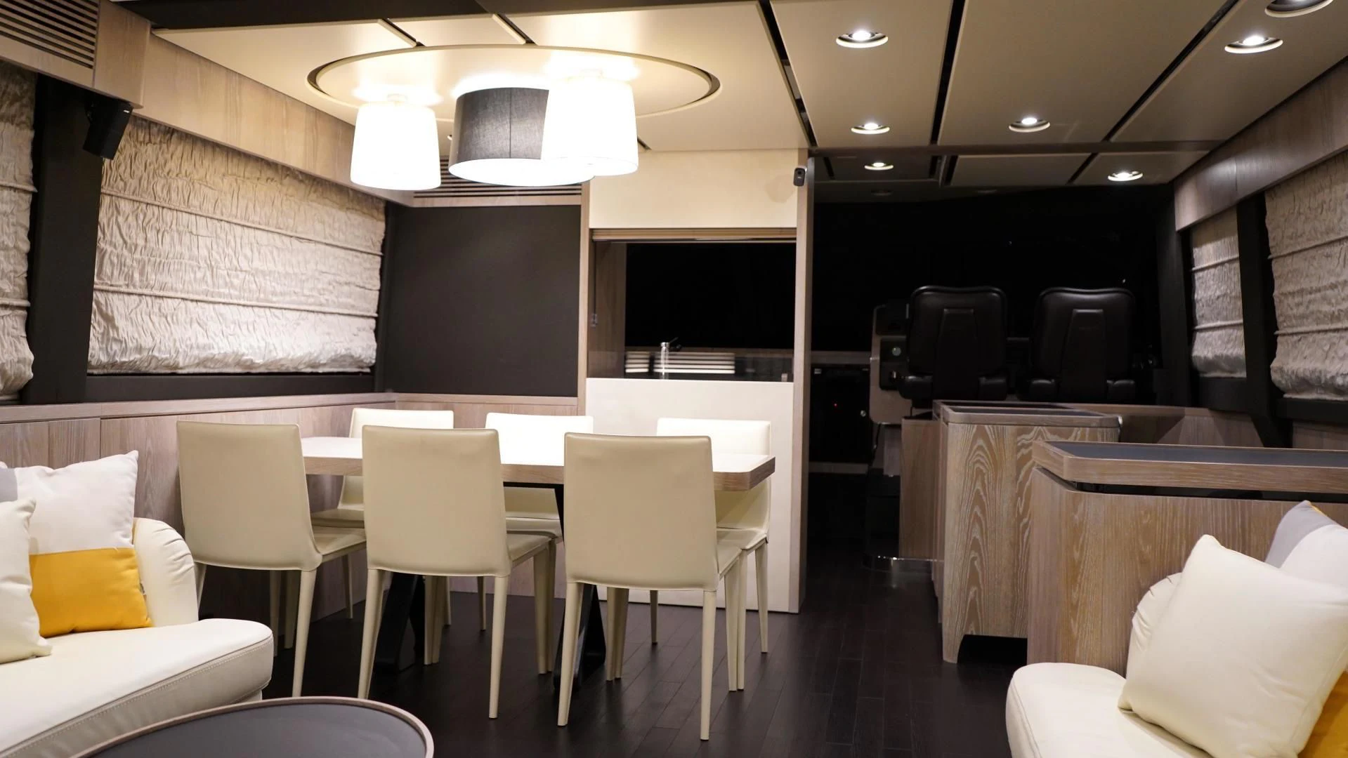 a room with tables and chairs aboard RAINBOW GODDESS Yacht for Sale