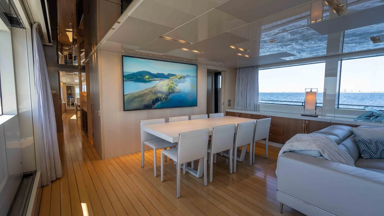 a room with a table and chairs aboard 106 FLYBRIDGE Yacht for Sale