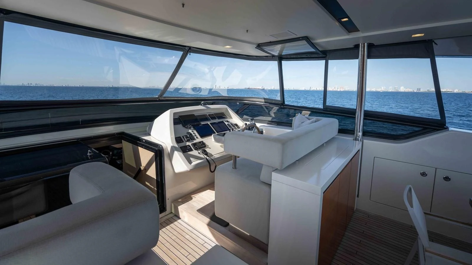 inside of a car aboard 106 FLYBRIDGE Yacht for Sale