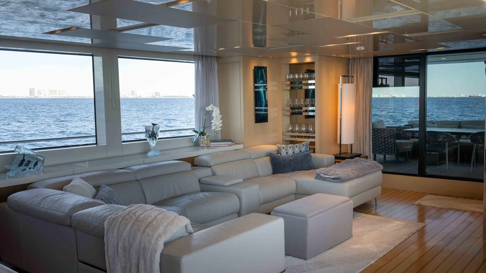 a living room with a large window aboard 106 FLYBRIDGE Yacht for Sale