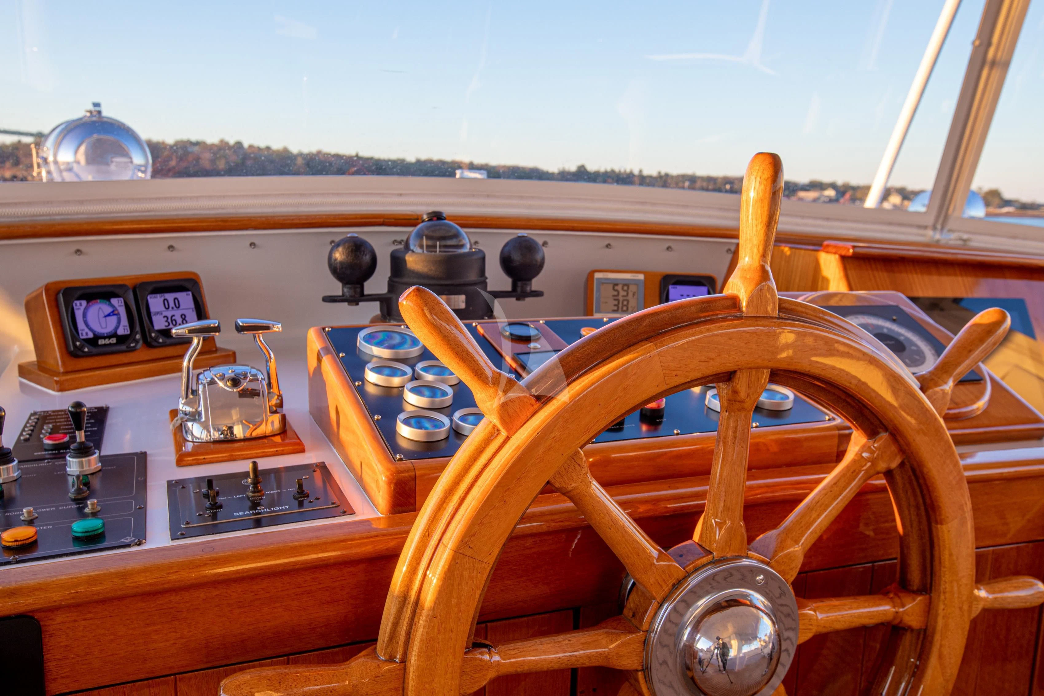 a wooden steering wheel in a boat aboard MARYBELLE Yacht for Sale